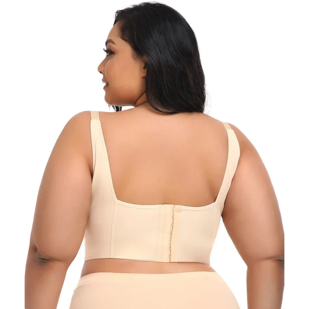 Woman showing the back of a nude push-up shaping bra, featuring a smoothing design and adjustable straps.